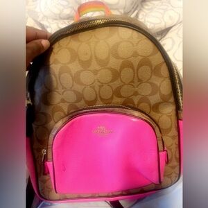 This is a fairly new coach book bag. Lots of space the pink is a hot pink.